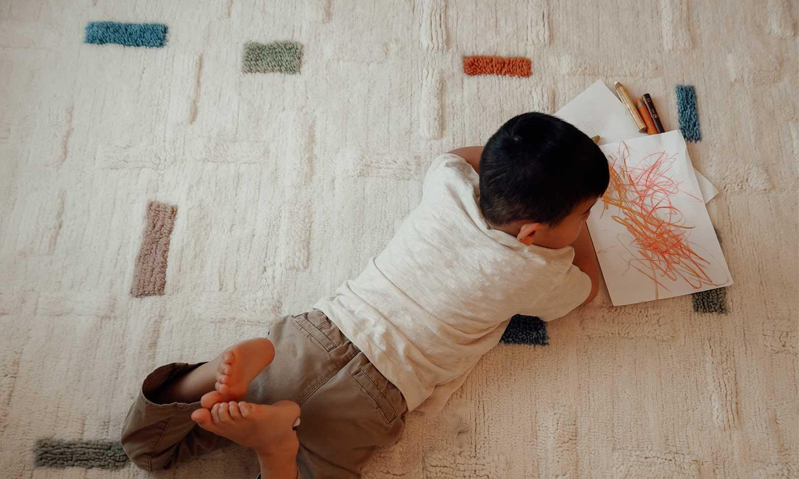 Classic brick-style wool rug in earthy tones, engineered for child-safe spaces and built for effortless washing.