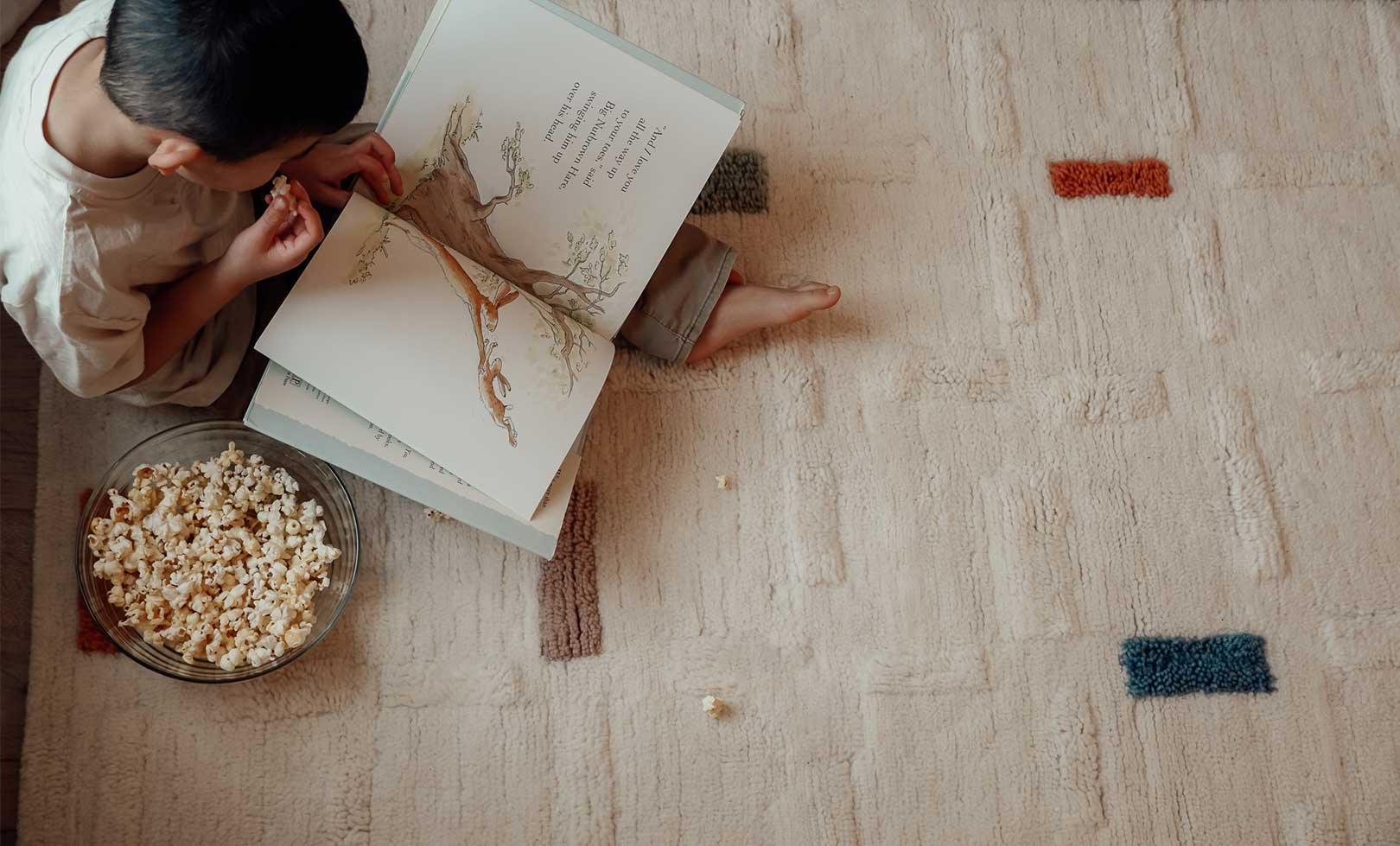 Washable wool children's rug with a structured brick pattern in warm earth tones, perfect for a grounded, cozy space.