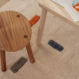 Thumbnail of a washable wool children's rug featuring a geometric brick-like pattern.