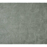 Colorful floral field rug made from safe, washable wool, designed to brighten up nurseries and play spaces.