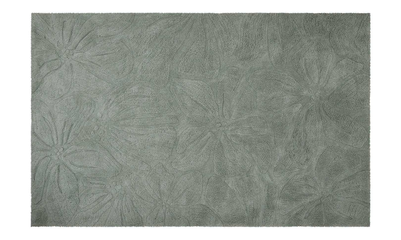 Colorful floral field rug made from safe, washable wool, designed to brighten up nurseries and play spaces.
