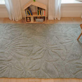 Thumbnail of a wool children’s rug with a colorful floral field pattern, soft and washable for everyday use.
