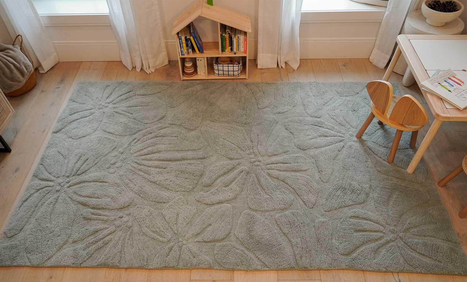 Thumbnail of a wool children’s rug with a colorful floral field pattern, soft and washable for everyday use.
