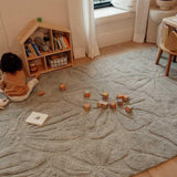 Washable wool children's rug with a vibrant floral field design, featuring colorful flowers on a soft background.