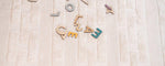 Neutral-toned, washable rug for children featuring a minimal nest design, made with non-toxic materials.