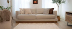 Minimalist Nest rug in neutral tones, created with non-toxic, washable materials for safe nursery environments.