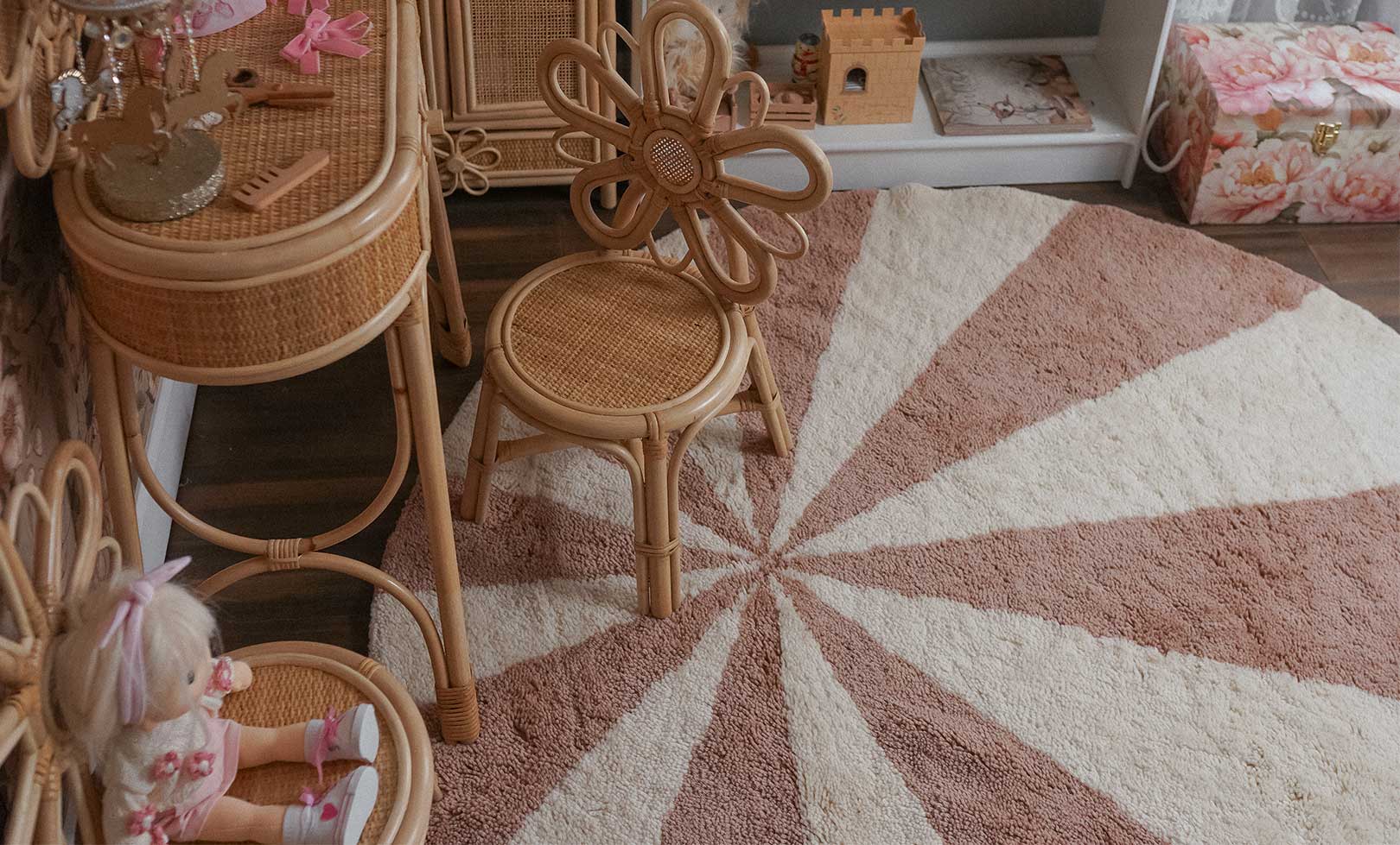 Children's room with wicker furniture and a washable wool children's rug.