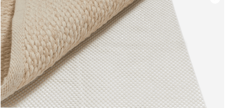 Medium-sized screenshot featuring the Sage & Wild Living website layout, highlighting eco-friendly rug options.