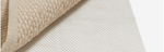 Medium-sized screenshot featuring the Sage & Wild Living website layout, highlighting eco-friendly rug options.