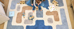 Organic washable wool area rug with a soft, neutral stacked design, ideal for modern children's rooms.