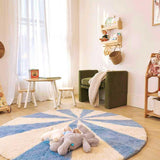 Compact view of a blue pinwheel wool rug, designed to brighten kids’ spaces with its playful, washable pattern.