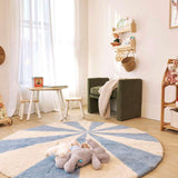 Compact view of a blue pinwheel wool rug, designed to brighten kids’ spaces with its playful, washable pattern.