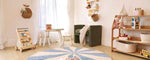 Compact view of a blue pinwheel wool rug, designed to brighten kids’ spaces with its playful, washable pattern.