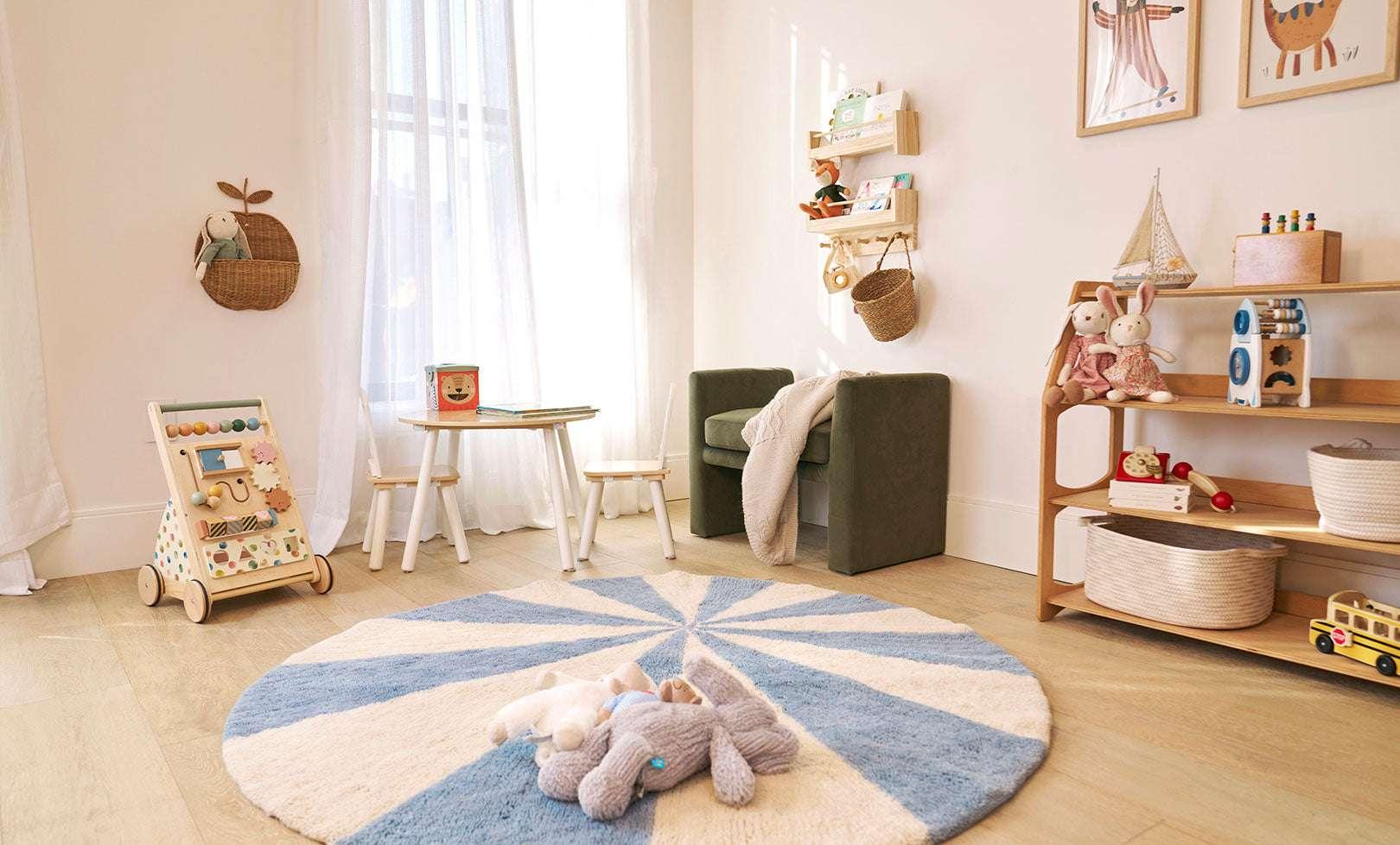 Compact view of a blue pinwheel wool rug, designed to brighten kids’ spaces with its playful, washable pattern.