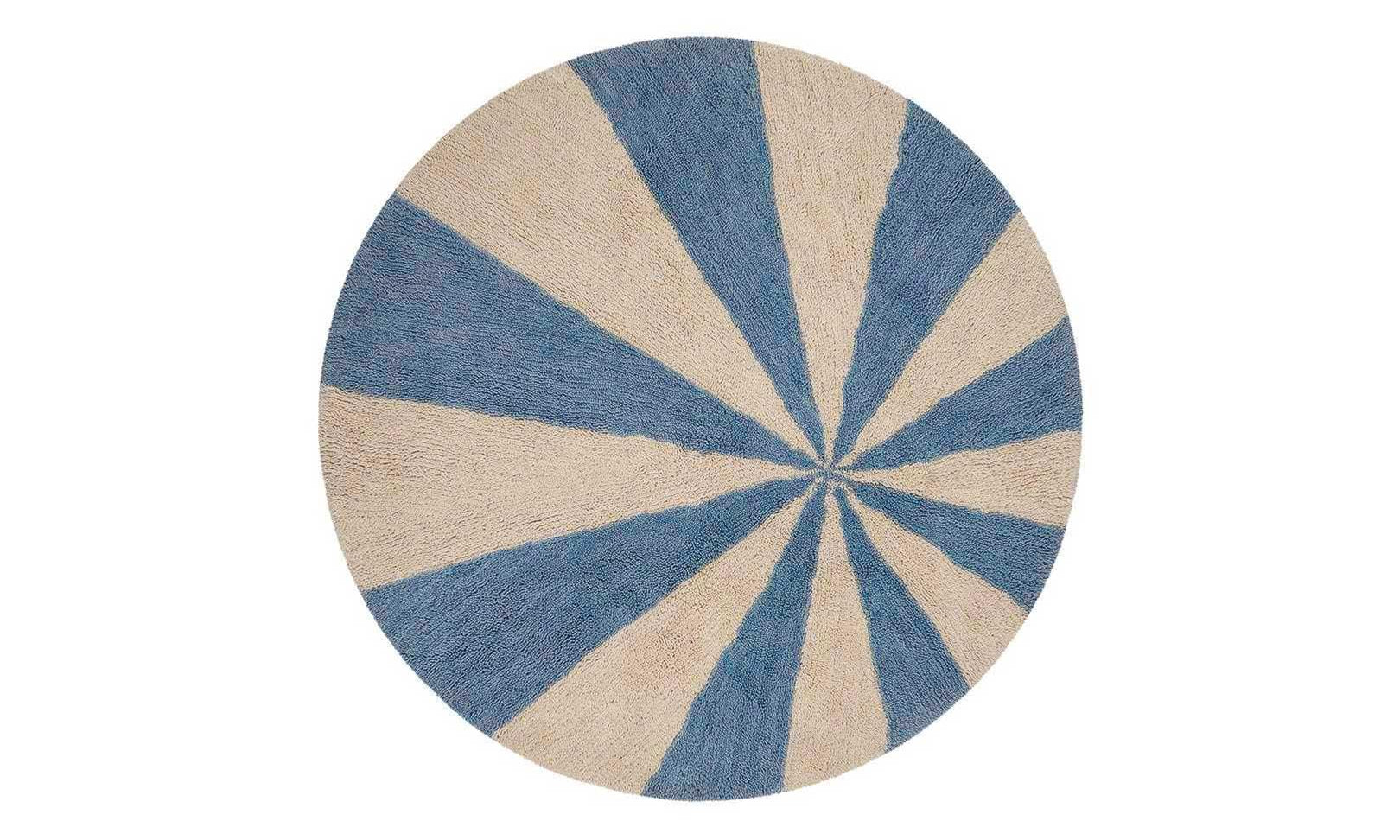 Washable wool children's rug featuring a calming blue pinwheel pattern, perfect for playful yet serene spaces.