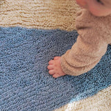 Fresh and lively wool rug featuring a bold blue pinwheel motif, perfect for active playrooms and easy cleaning.