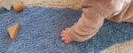 Fresh and lively wool rug featuring a bold blue pinwheel motif, perfect for active playrooms and easy cleaning.