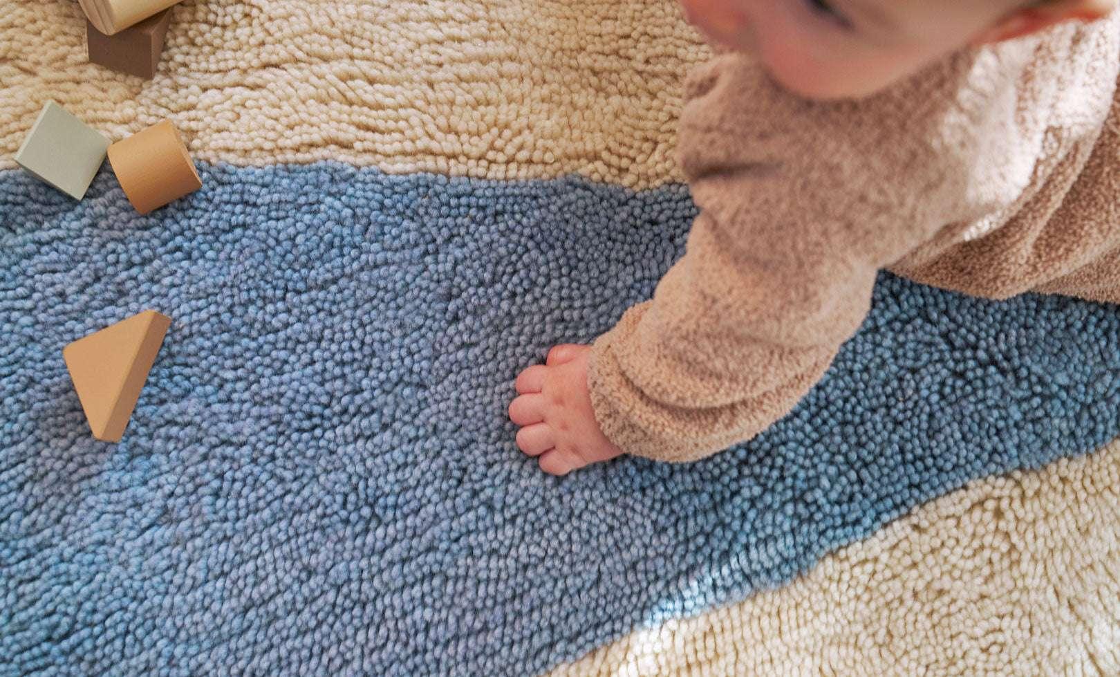 Fresh and lively wool rug featuring a bold blue pinwheel motif, perfect for active playrooms and easy cleaning.