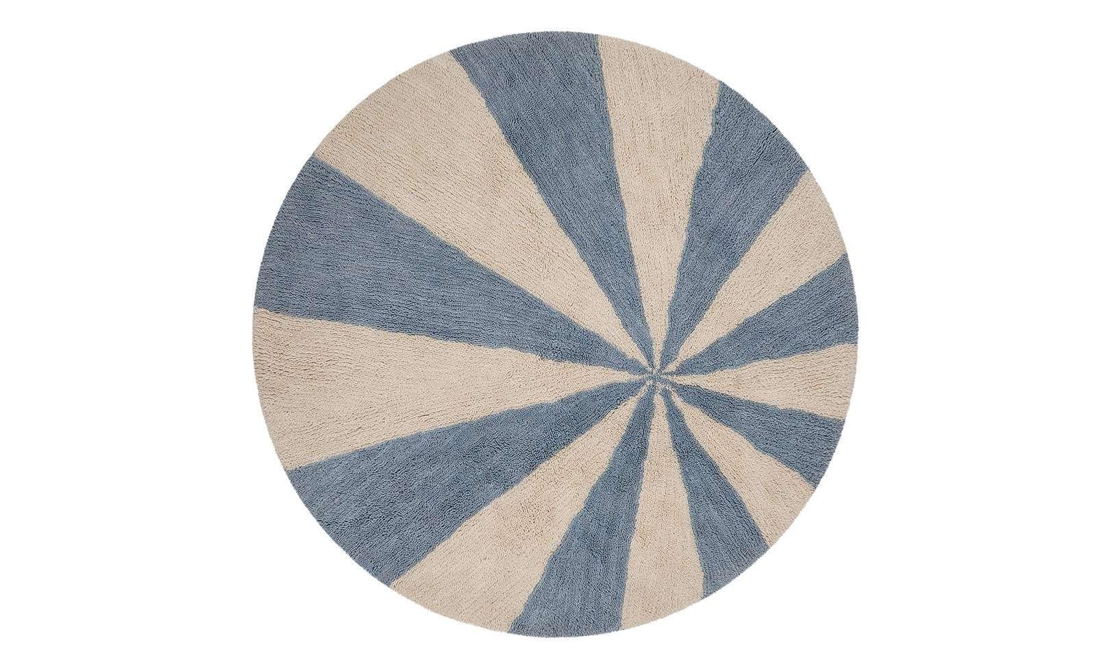 Washable wool children's rug featuring a calming blue pinwheel pattern, perfect for playful yet serene spaces.