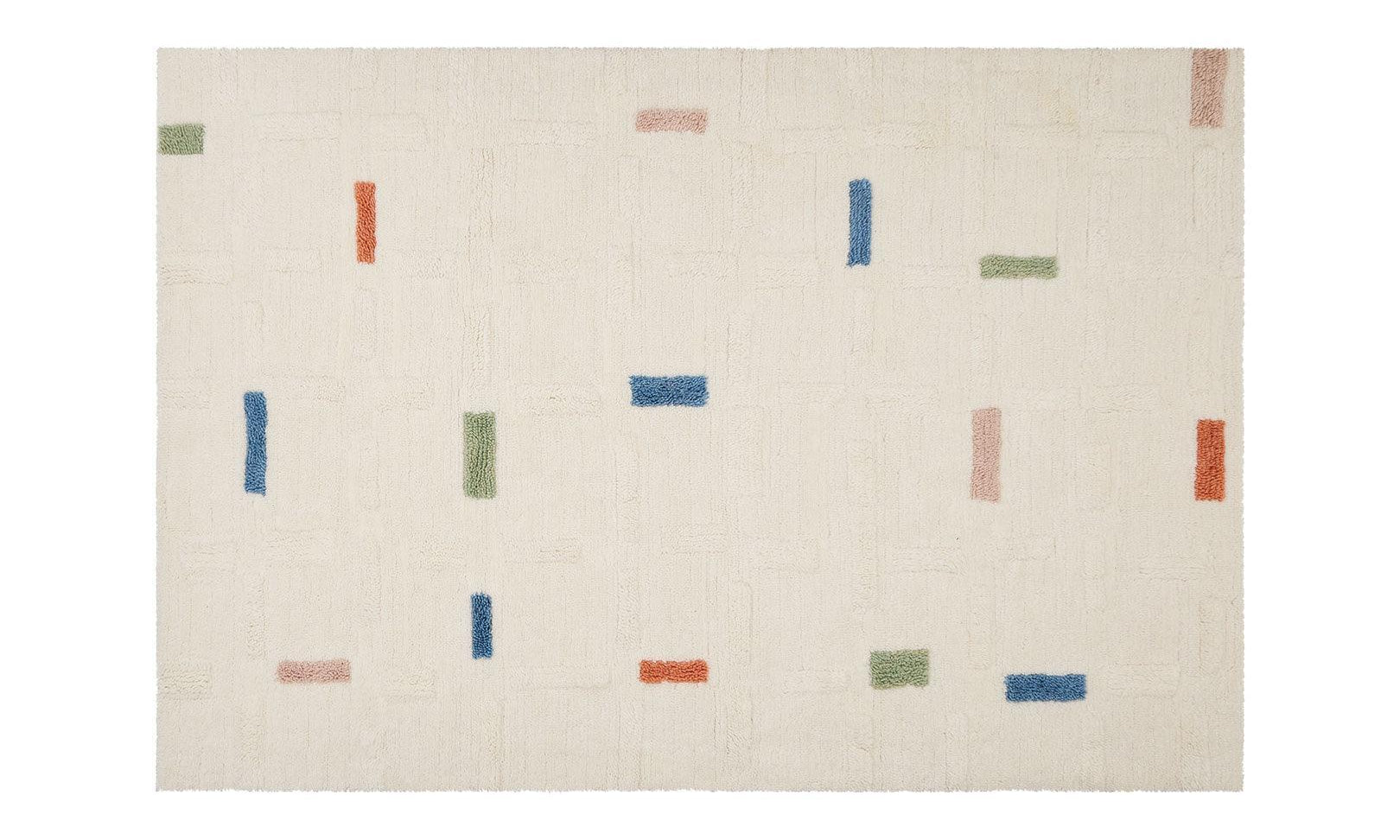 Full view of a wool children's rug with a structured brick design, crafted from soft, washable material.