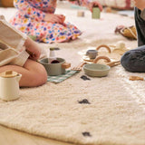 Stylish dotted black non-toxic organic children's rug, perfect for modern nursery decor.