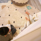 Stylish black dot rug made with organic fibers, offering a bold contrast and a washable, non-toxic foundation for kids.