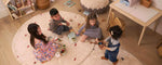 An organic, non-toxic children's rug with a dotted rust pattern, safe for kids.