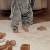 Full view of Flower 6 washable wool rug with multicolor blooms, ideal for cozy and colorful nursery spaces.