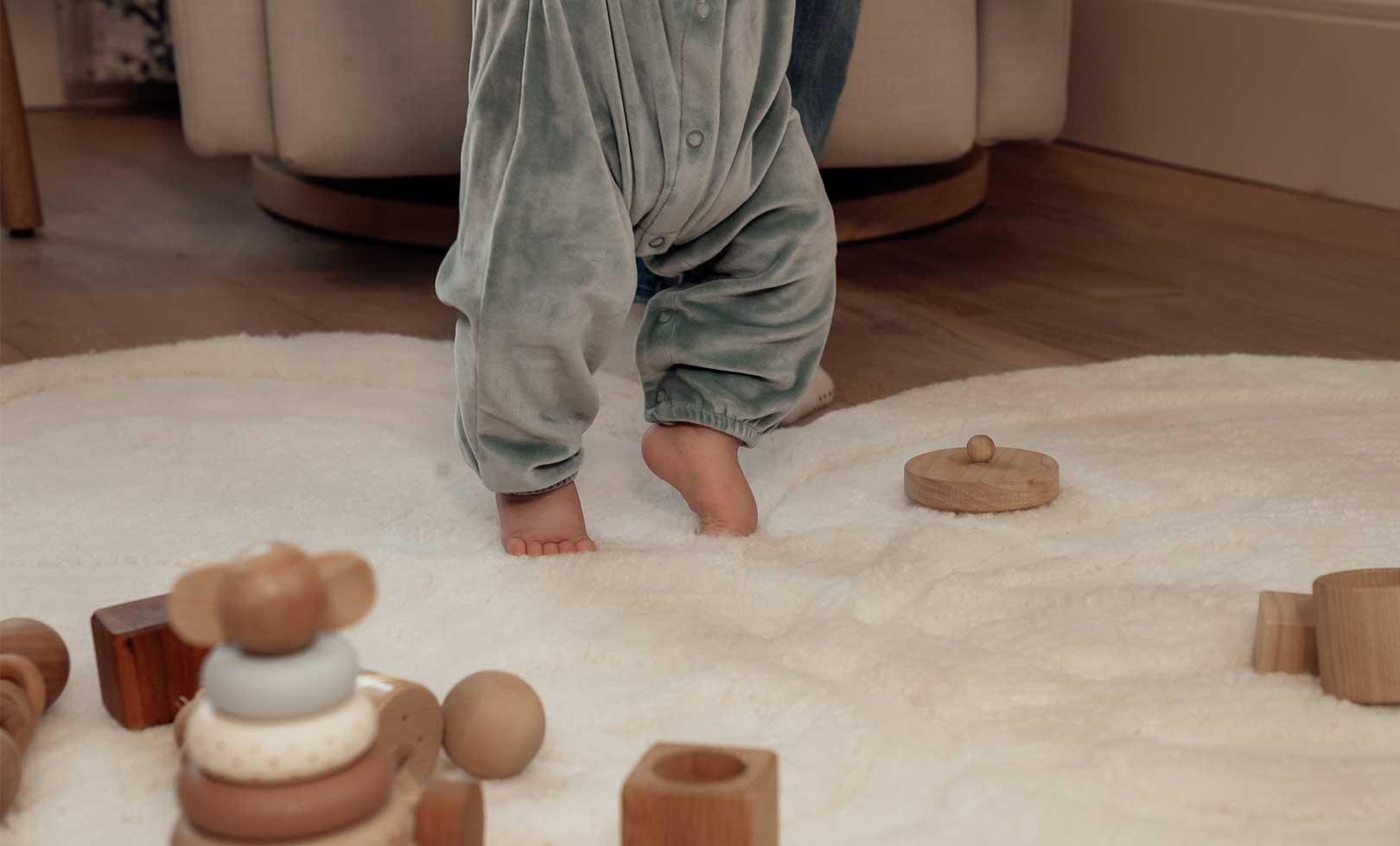 Full view of Flower 6 washable wool rug with multicolor blooms, ideal for cozy and colorful nursery spaces.