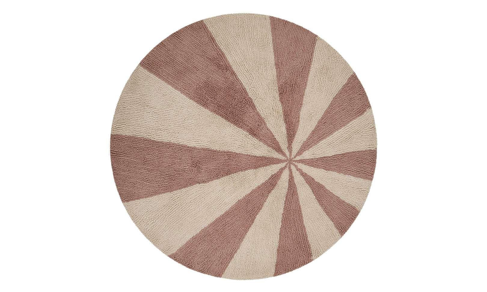 Washable wool children’s rug featuring a pink pinwheel design, combining softness with playful charm.