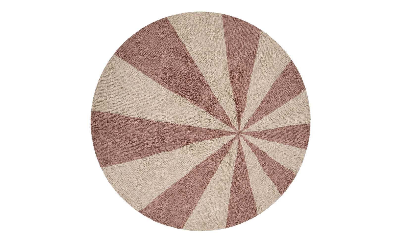 Washable wool children’s rug featuring a pink pinwheel design, combining softness with playful charm.